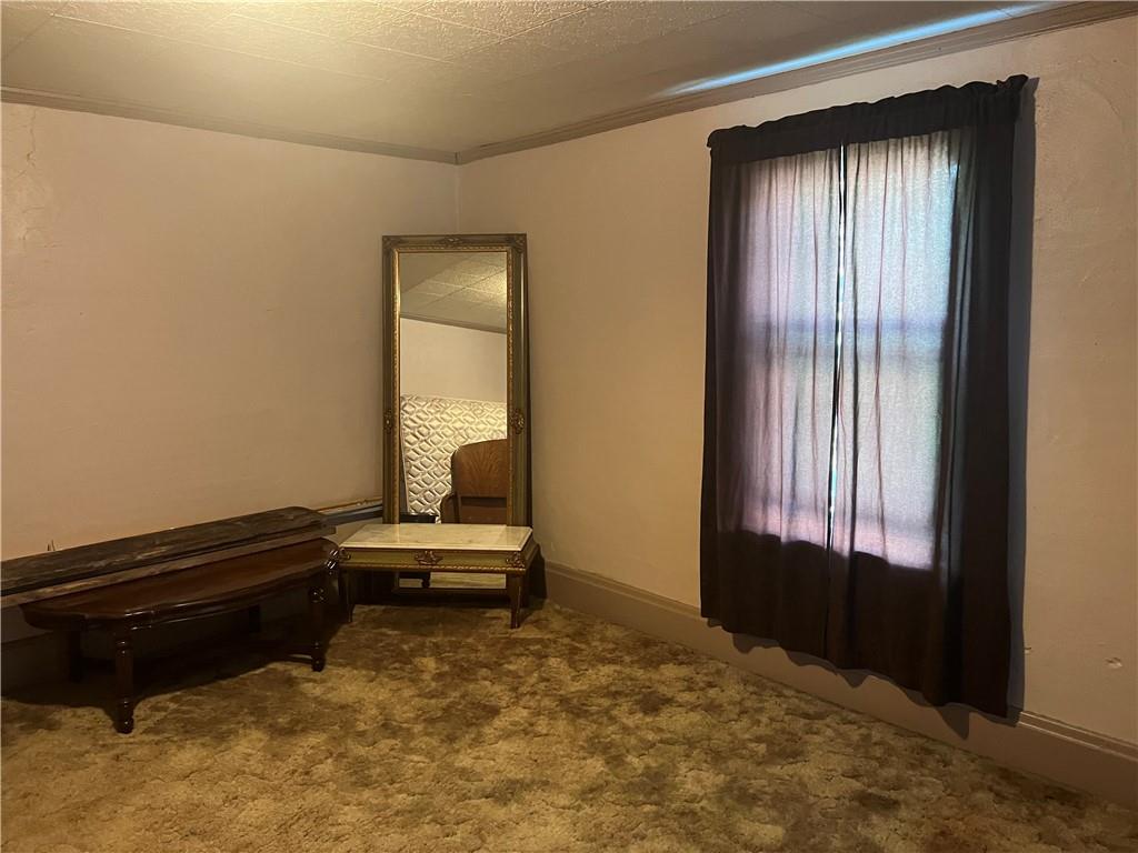 209-211 Old School Road Luxor, PA 15662 - Photo 12 of 27 a living room with a bed and a window