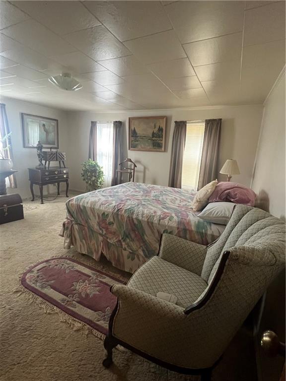 209-211 Old School Road Luxor, PA 15662 - Photo 13 of 27 a bedroom with a bed couch and window