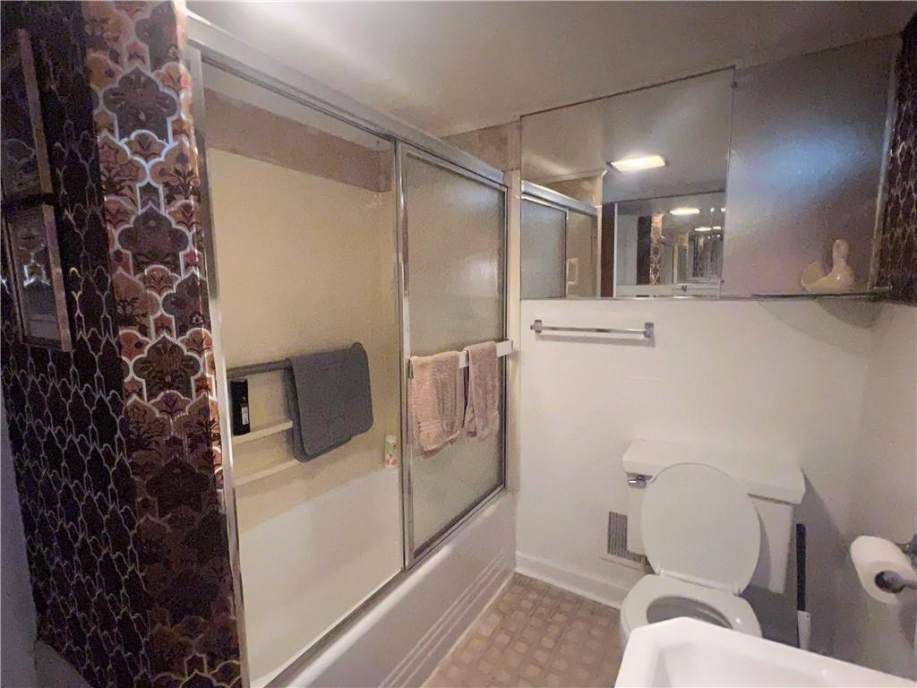 209-211 Old School Road Luxor, PA 15662 - Photo 15 of 27 a bathroom with a sink toilet and shower