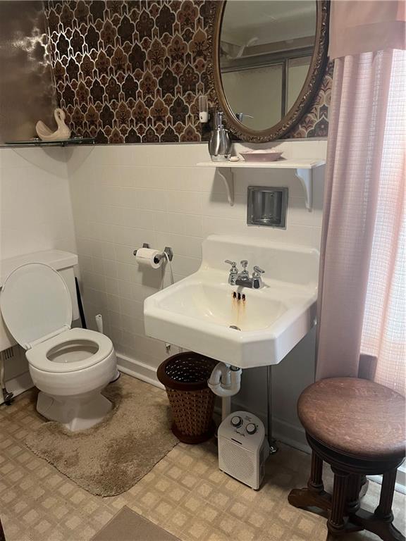 209-211 Old School Road Luxor, PA 15662 - Photo 16 of 27 a bathroom with a sink toilet and a mirror