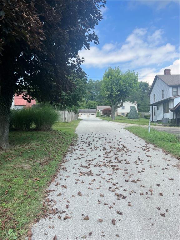 209-211 Old School Road Luxor, PA 15662 - Photo 22 of 27 a backyard of a house with lots of green space