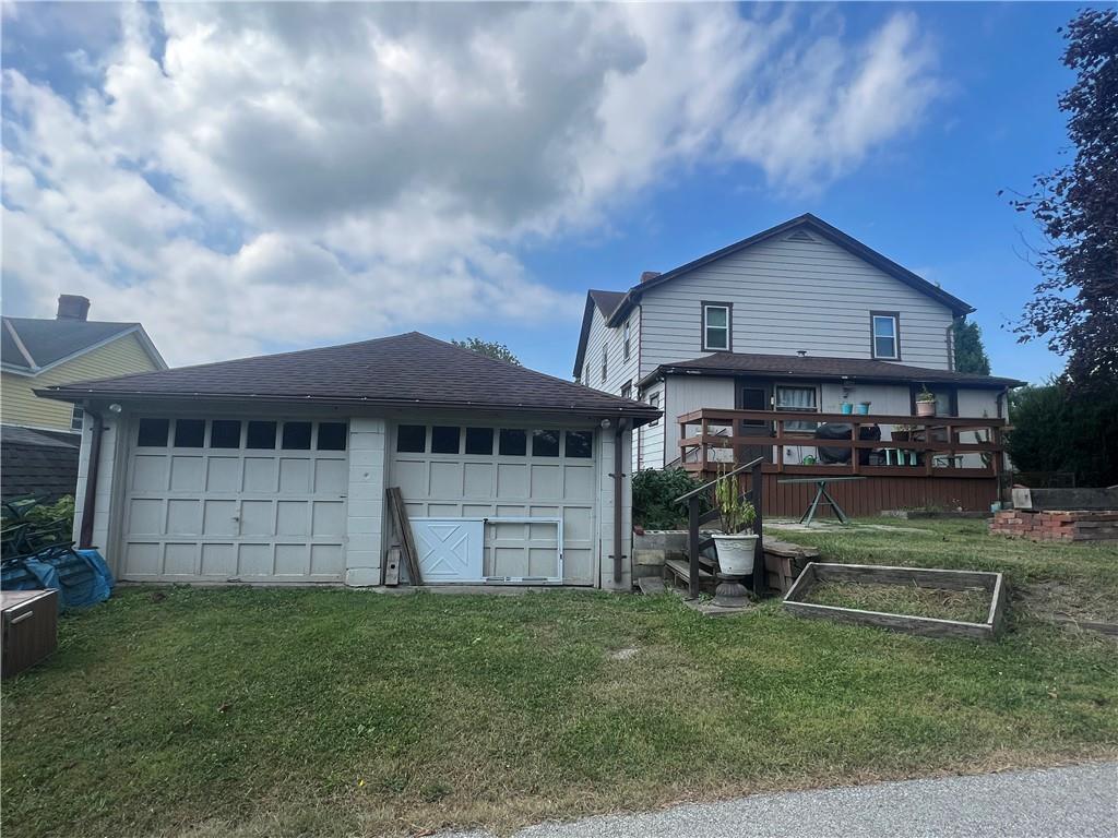 209-211 Old School Road Luxor, PA 15662 - Photo 24 of 27 a front view of a house with a garden