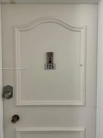 a bedroom with two beds and painted walls