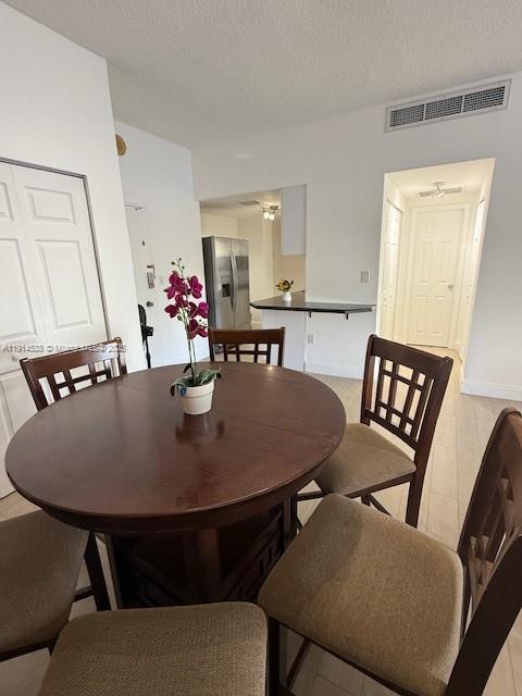500 Bayview Drive, Unit 125 Sunny Isles Beach, FL 33160 - Photo 7 of 19 a dining room with furniture and wooden floor