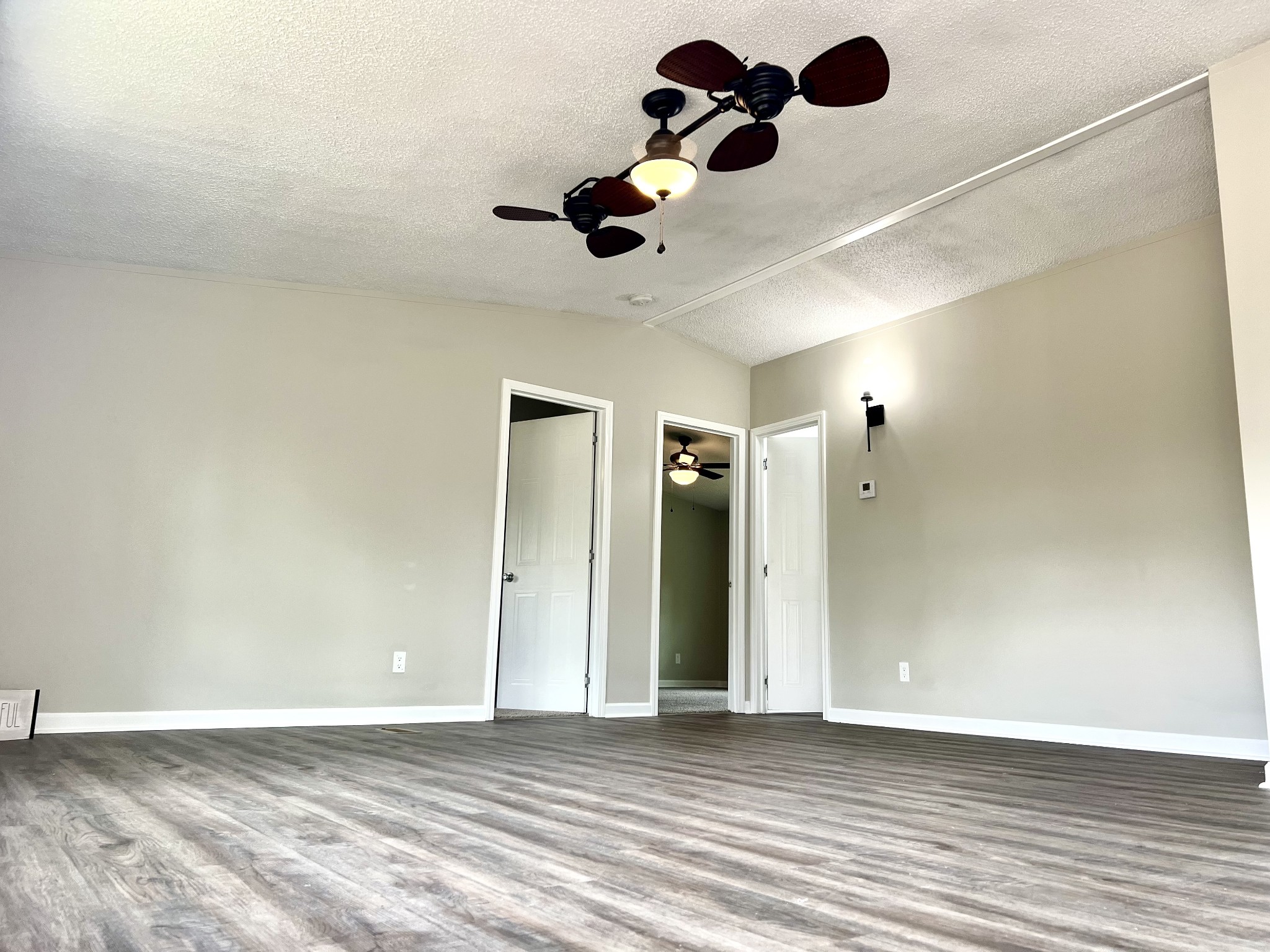 655 White Road Wartrace, TN 37183 - Photo 15 of 27 an empty room with wooden floor and windows