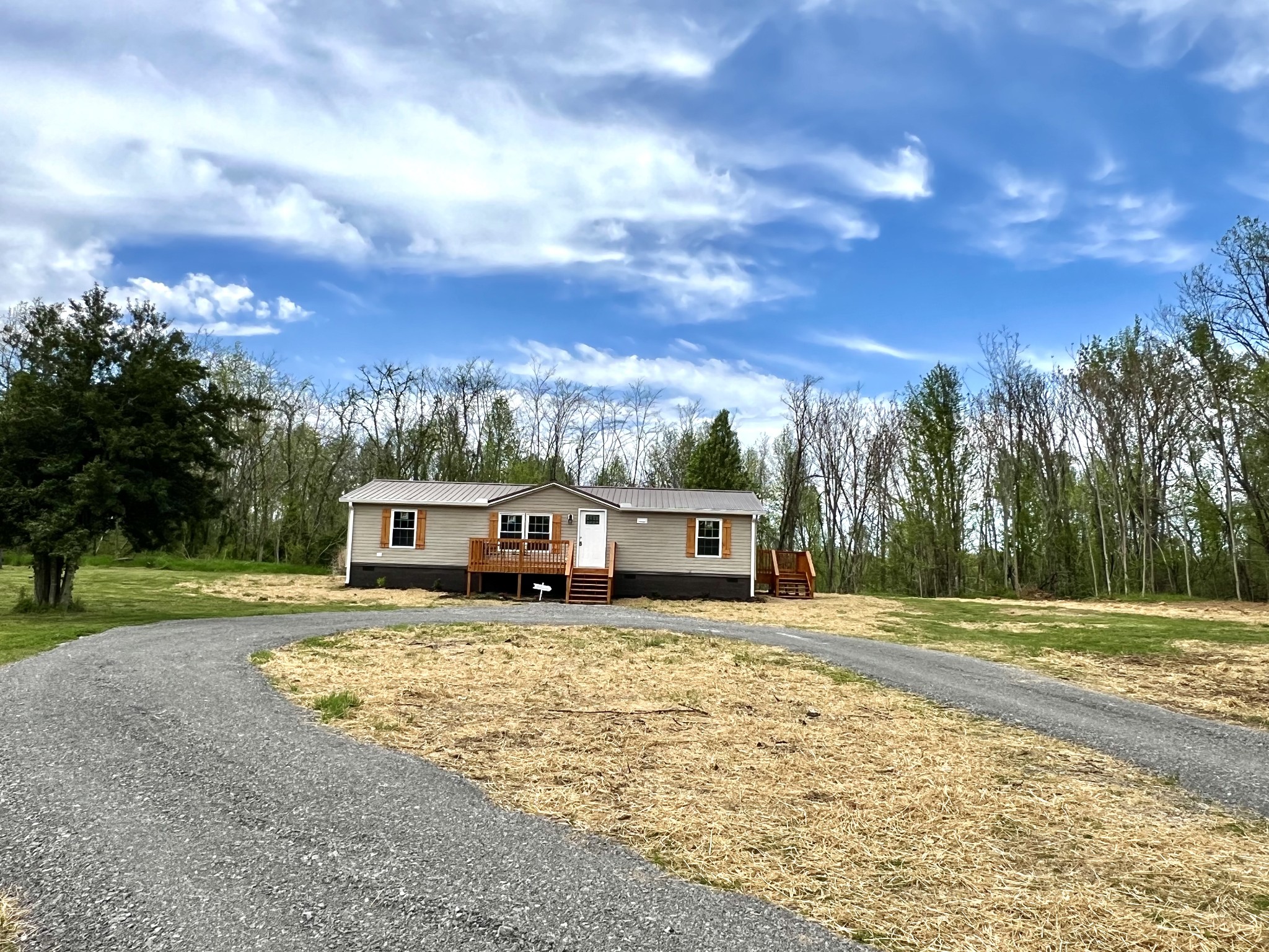655 White Road Wartrace, TN 37183 - Photo 2 of 27 a view of a house with a yard and trees in the background