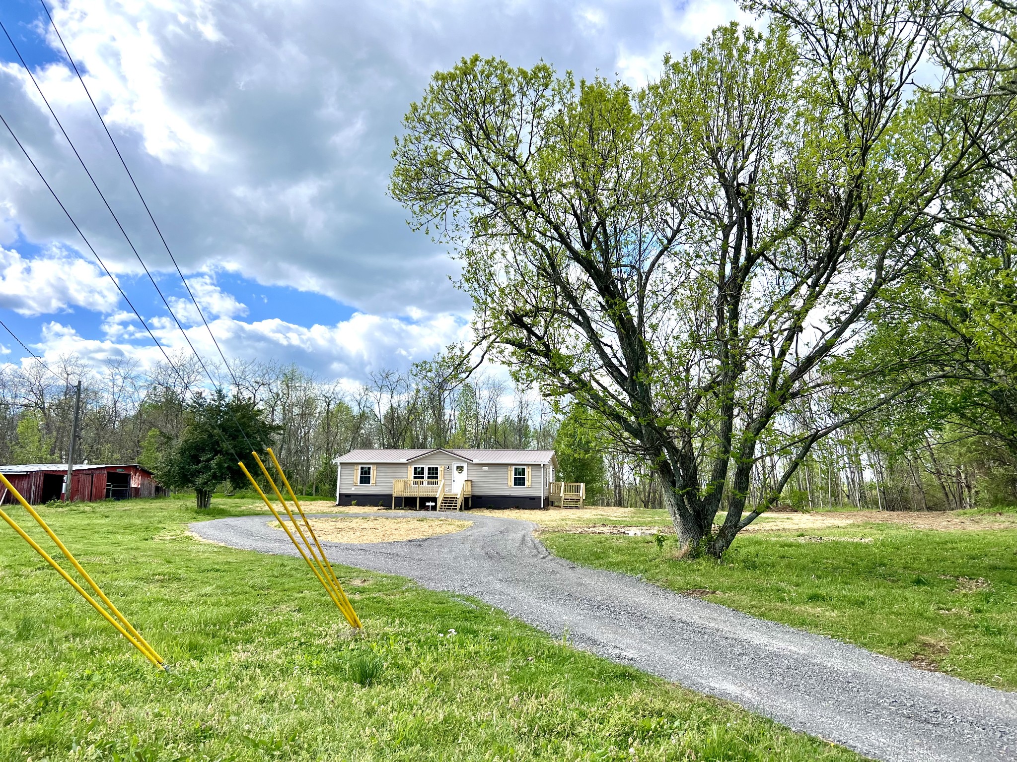 655 White Road Wartrace, TN 37183 - Photo 8 of 27 a front view of a house with a yard