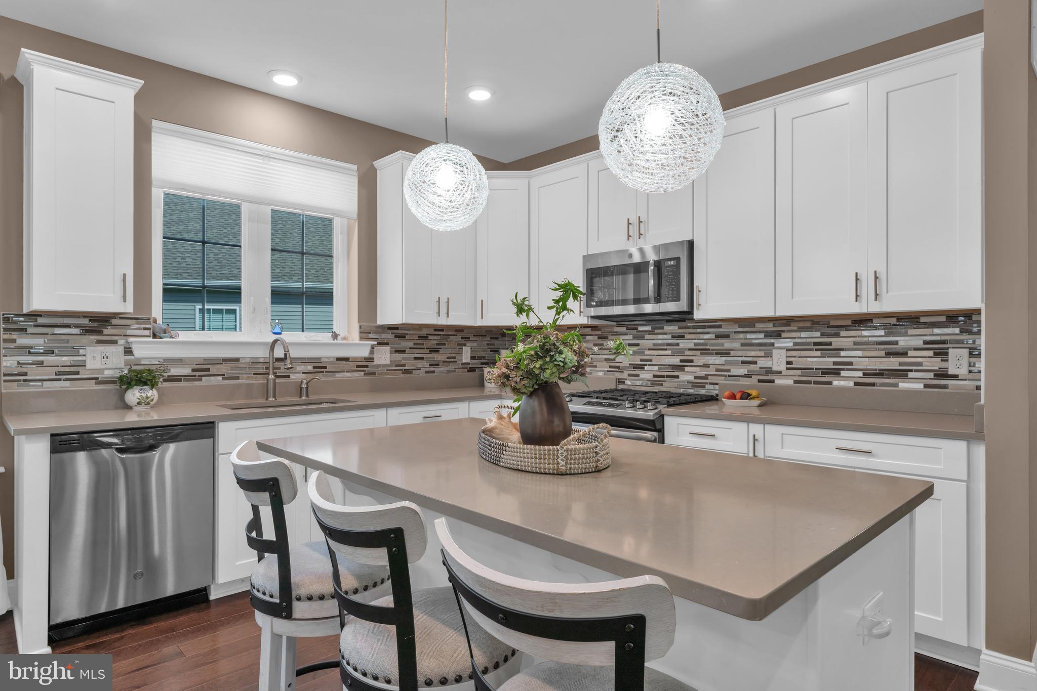 66 Butler Drive Barnegat, NJ 08005 - Photo 1 of 49 a kitchen with cabinets a sink and a stove