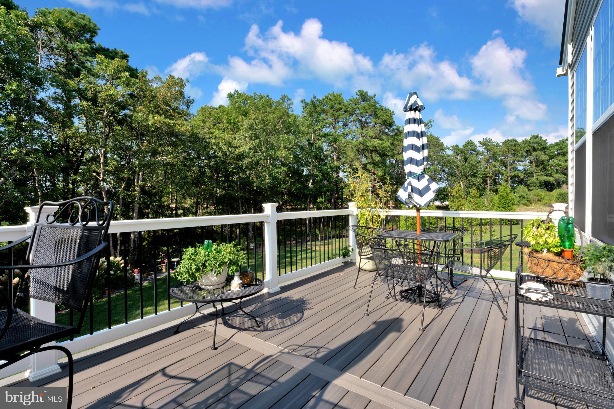 66 Butler Drive Barnegat, NJ 08005 - Photo 28 of 49 a view of a deck with two chair and a table