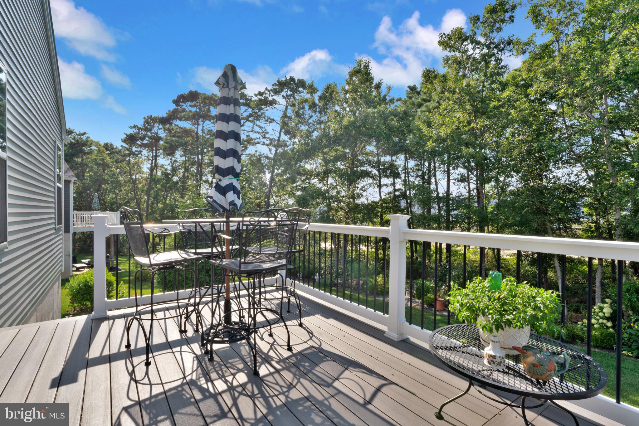 66 Butler Drive Barnegat, NJ 08005 - Photo 29 of 49 a view of a balcony with wooden floor and outdoor seating