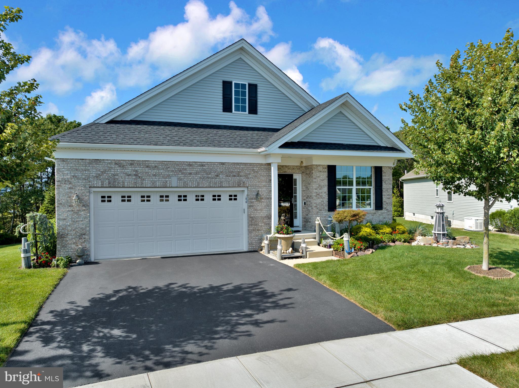 66 Butler Drive Barnegat, NJ 08005 - Photo 32 of 49 a front view of a house with a yard and porch
