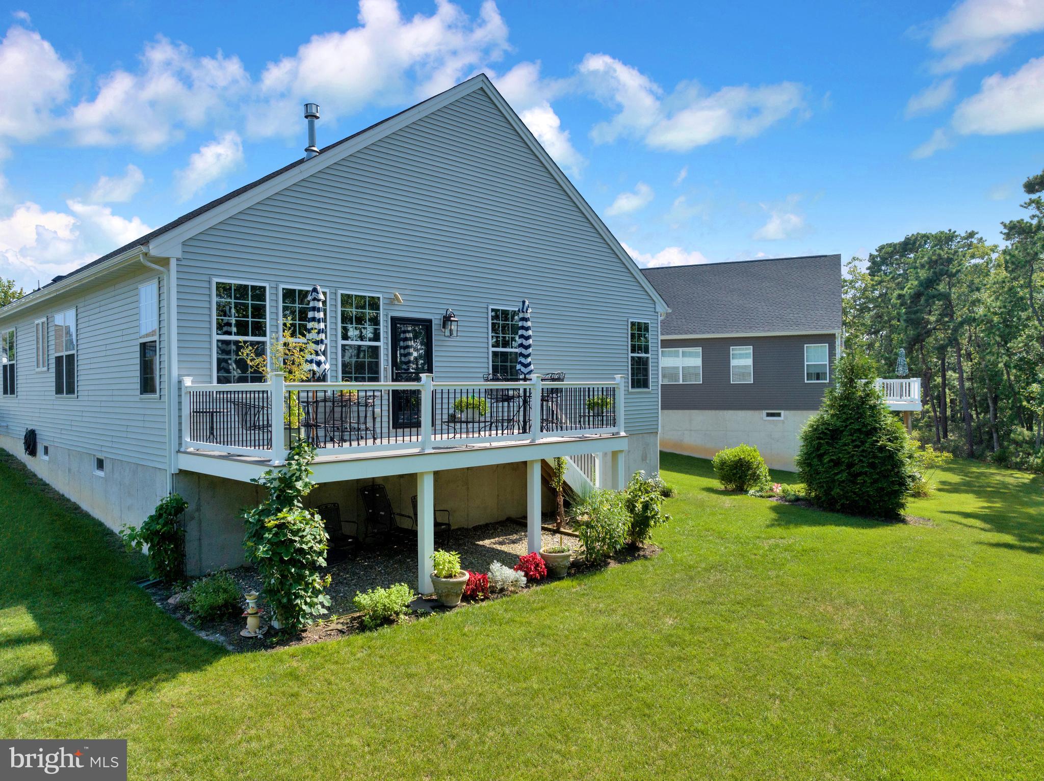 66 Butler Drive Barnegat, NJ 08005 - Photo 40 of 49 a view of an house with backyard space and garden