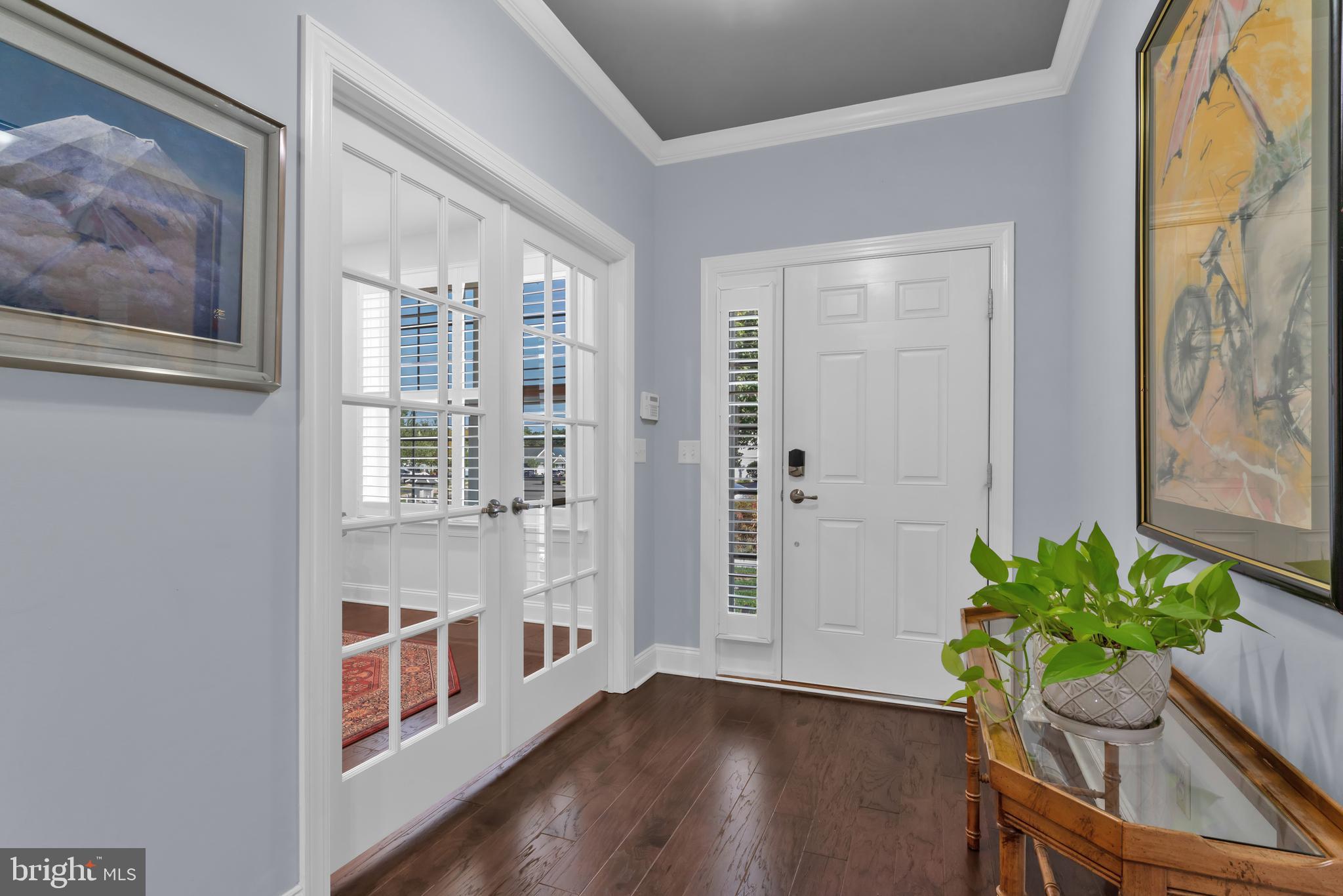 66 Butler Drive Barnegat, NJ 08005 - Photo 4 of 49 a view of an entryway with wooden floor and a potted plant