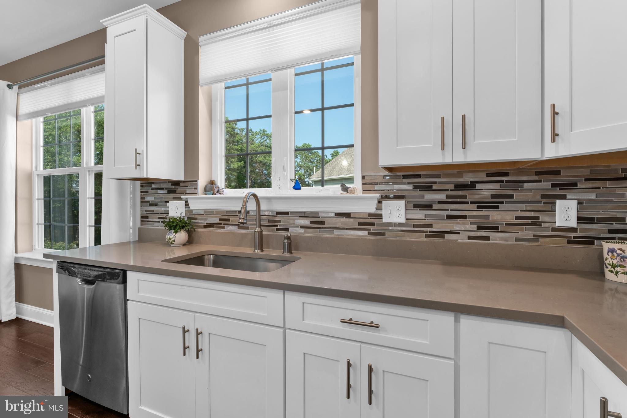 66 Butler Drive Barnegat, NJ 08005 - Photo 9 of 49 a kitchen with stainless steel appliances white cabinets and a window
