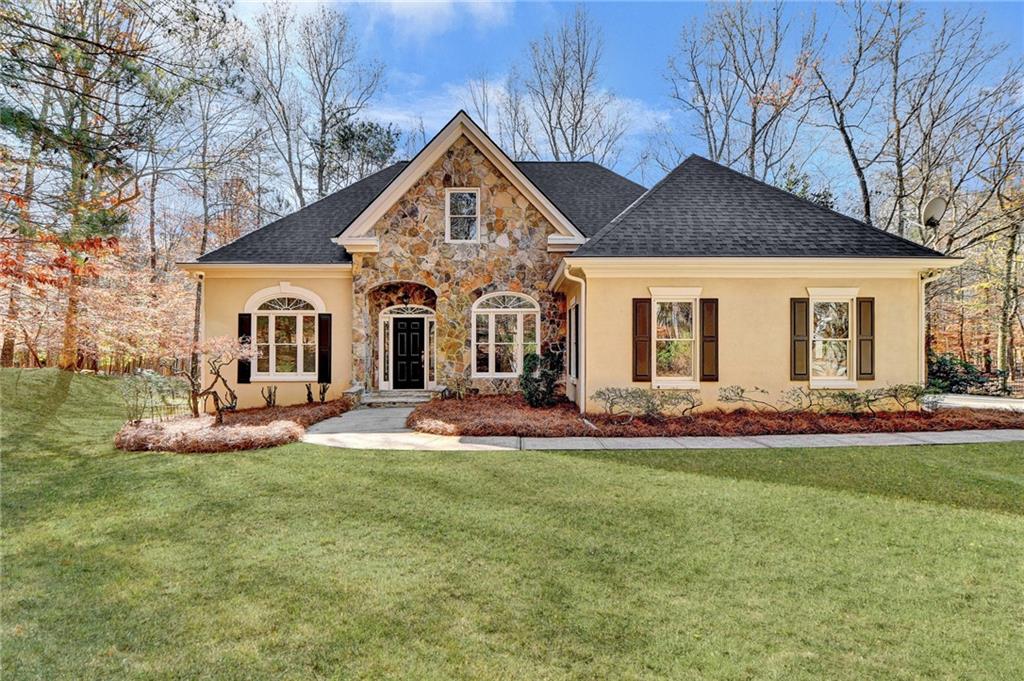 a front view of a house with a yard