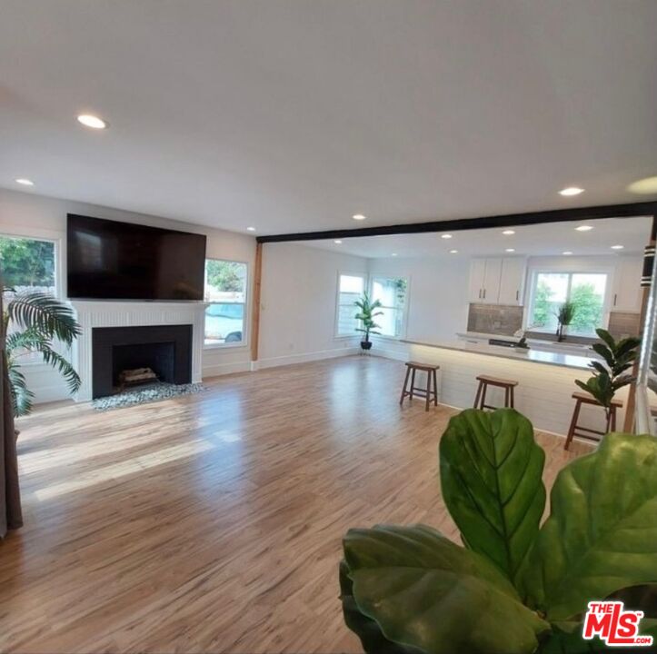 2560 Cotner Avenue Los Angeles, CA 90064 - Photo 16 of 20 a living room with furniture a flat screen tv and a fireplace