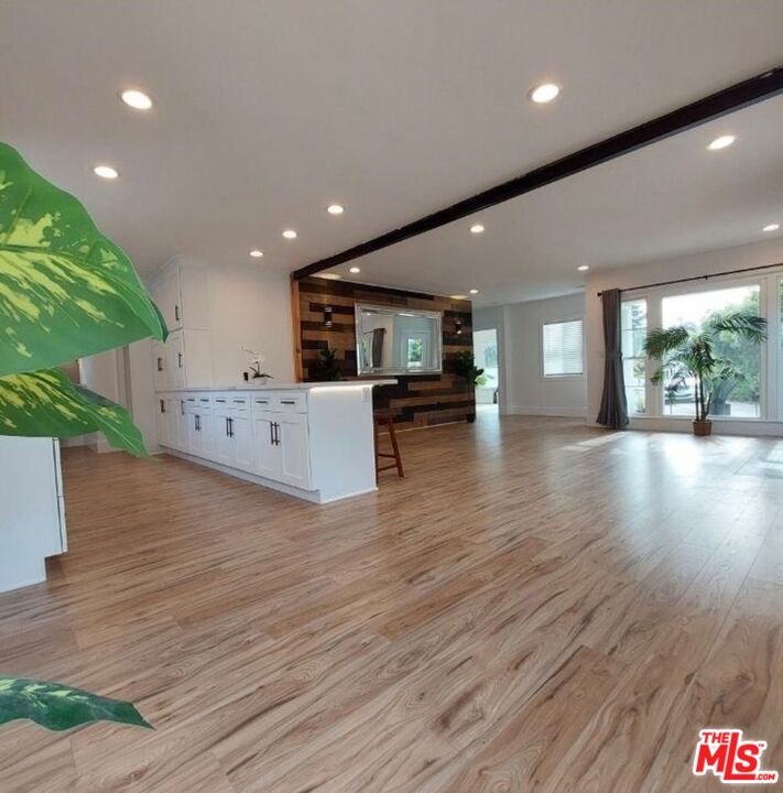 2560 Cotner Avenue Los Angeles, CA 90064 - Photo 17 of 20 a living room with stainless steel appliances furniture wooden floor and a kitchen view