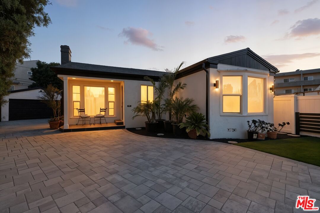 2560 Cotner Avenue Los Angeles, CA 90064 - Photo 2 of 20 a view of a house with yard and garden