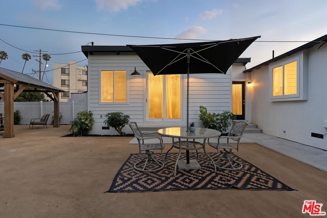 2560 Cotner Avenue Los Angeles, CA 90064 - Photo 5 of 20 a backyard of a house with table and chairs
