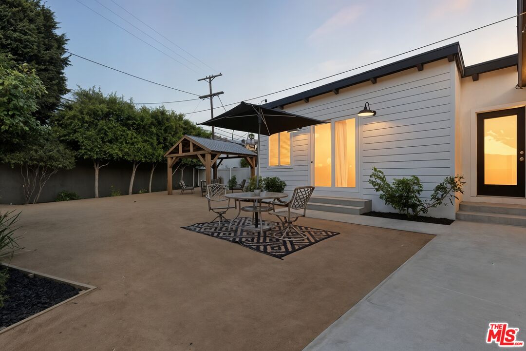 2560 Cotner Avenue Los Angeles, CA 90064 - Photo 7 of 20 a view of a patio with table and chairs and potted plants