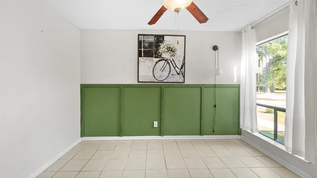 a view of an entryway with a chandelier fan