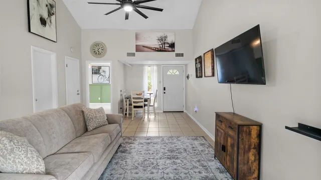 a living room with furniture and a flat screen tv