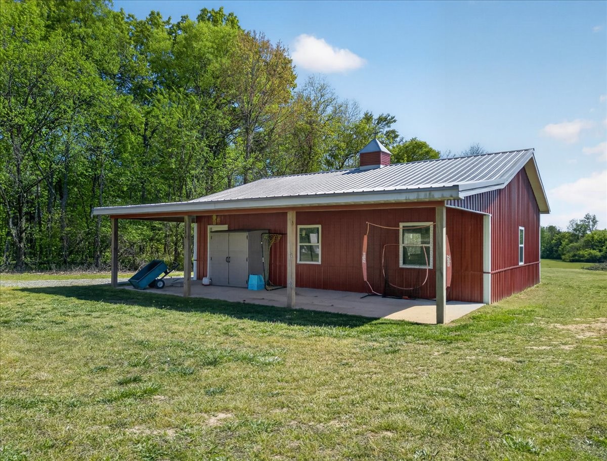 11039 Panther Creek Road Christiana, TN 37037 - Photo 54 of 76 a view of a house with a yard and sitting area