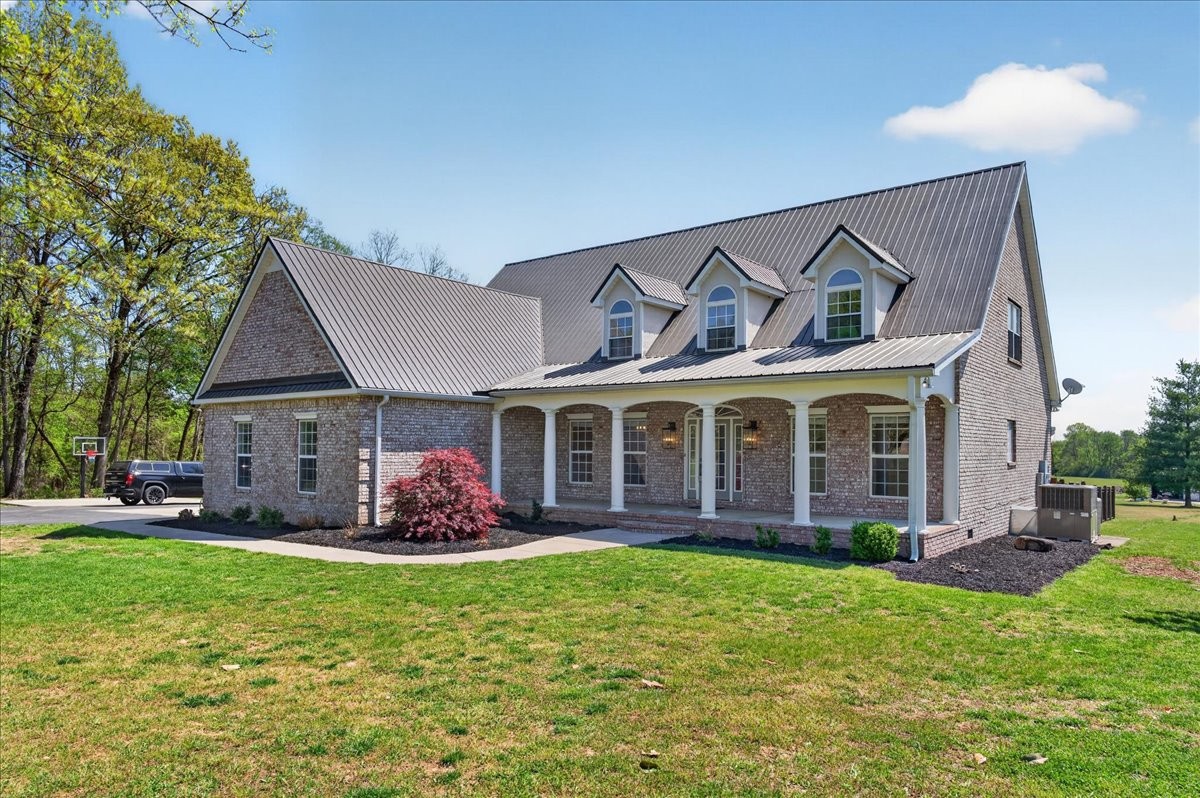 11039 Panther Creek Road Christiana, TN 37037 - Photo 61 of 76 a front view of a house with garden