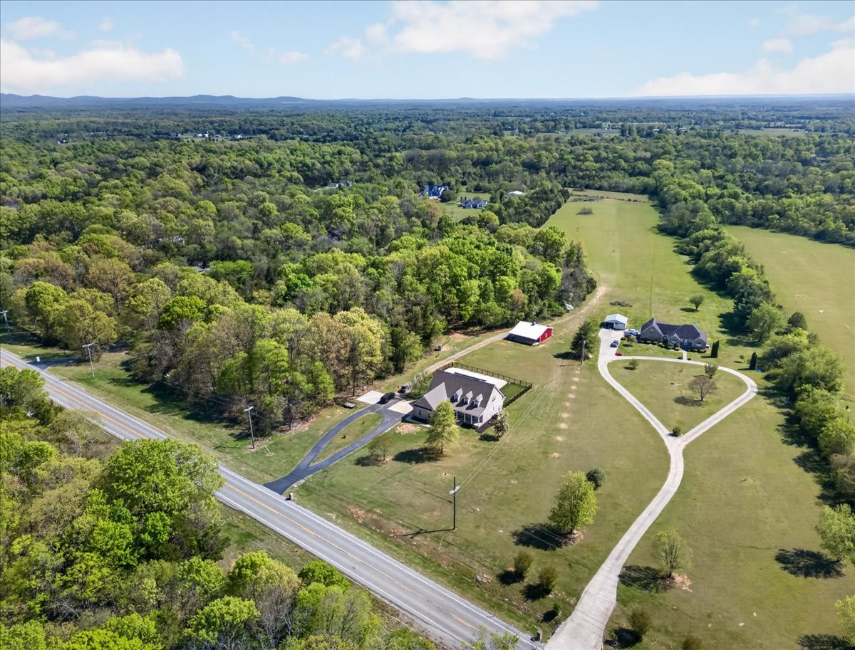 11039 Panther Creek Road Christiana, TN 37037 - Photo 66 of 76 an aerial view of a house with a swimming pool
