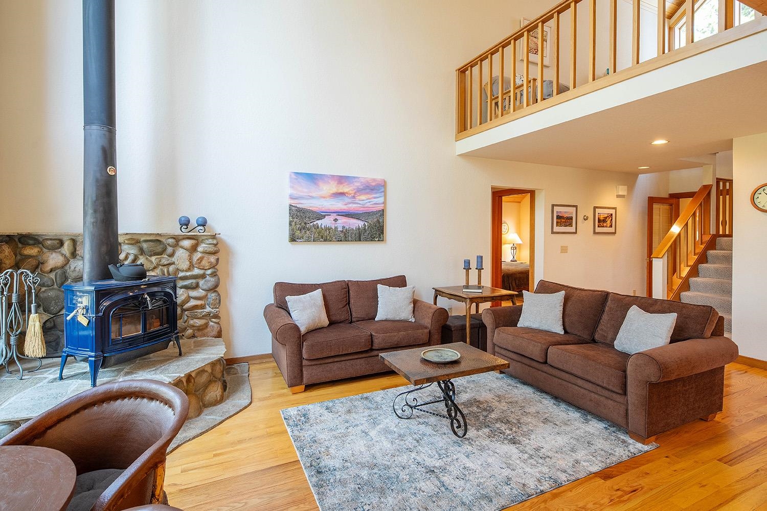 11904 Bennett Flat Road Truckee, CA 96161 - Photo 5 of 21 a living room with furniture a rug and a fireplace