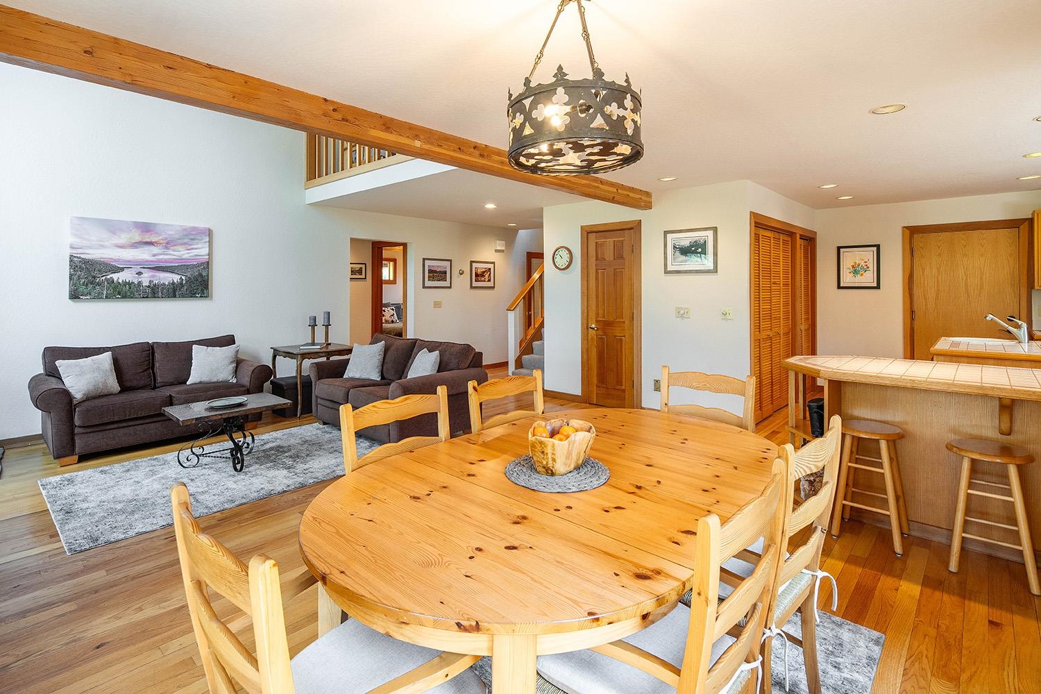 11904 Bennett Flat Road Truckee, CA 96161 - Photo 8 of 21 a living room with dining table and a chandelier