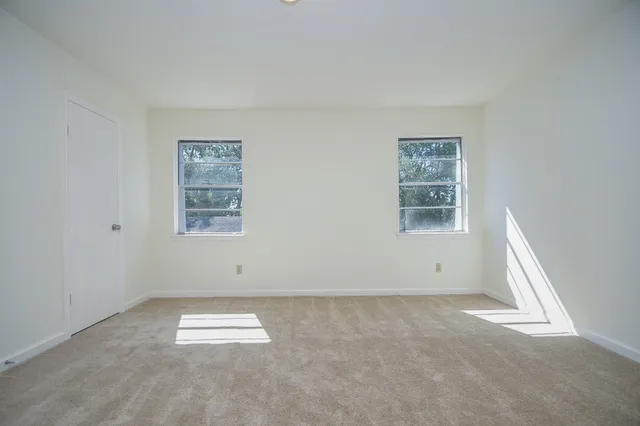 an empty room with windows
