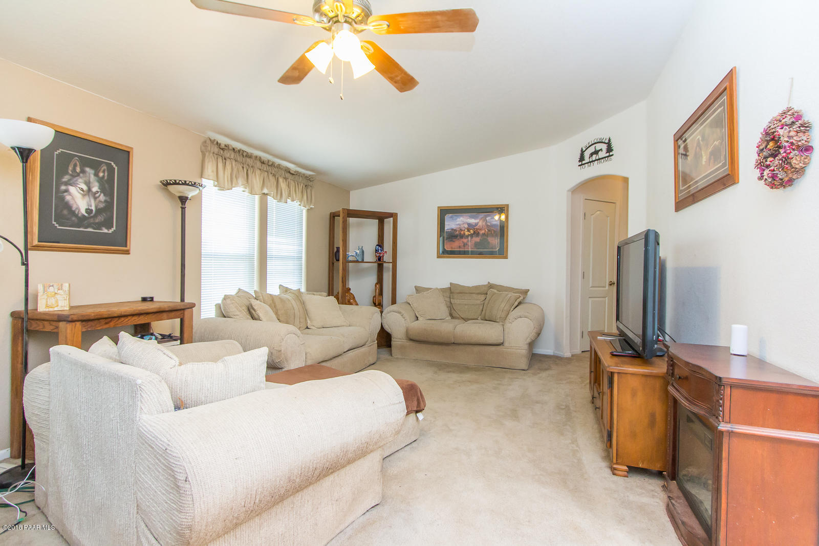 2691 North Reed Road Chino Valley, AZ 86323 - Photo 17 of 36 a living room with furniture and a flat screen tv