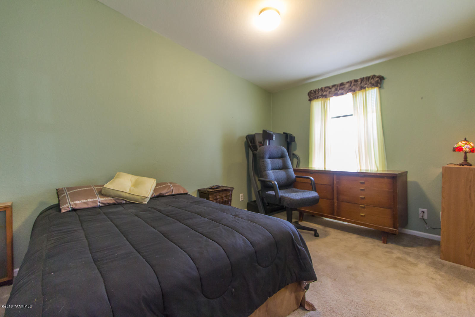 2691 North Reed Road Chino Valley, AZ 86323 - Photo 23 of 36 a bedroom with a bed and a window