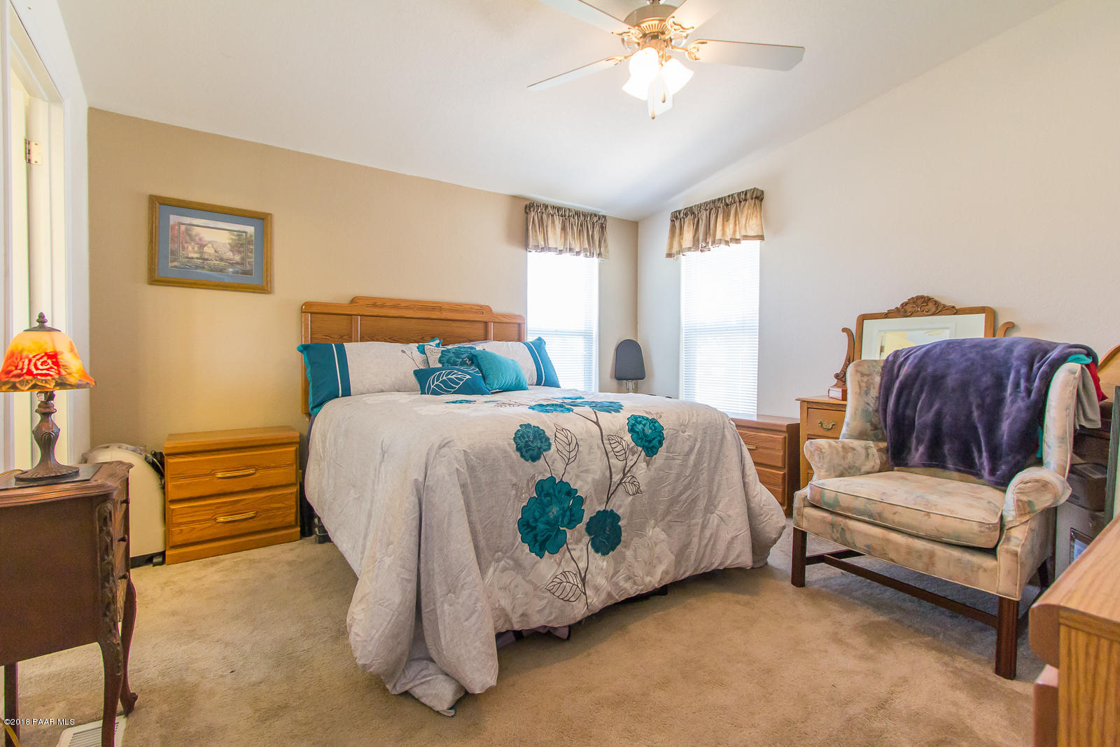 2691 North Reed Road Chino Valley, AZ 86323 - Photo 24 of 36 a bedroom with a bed and a chandelier