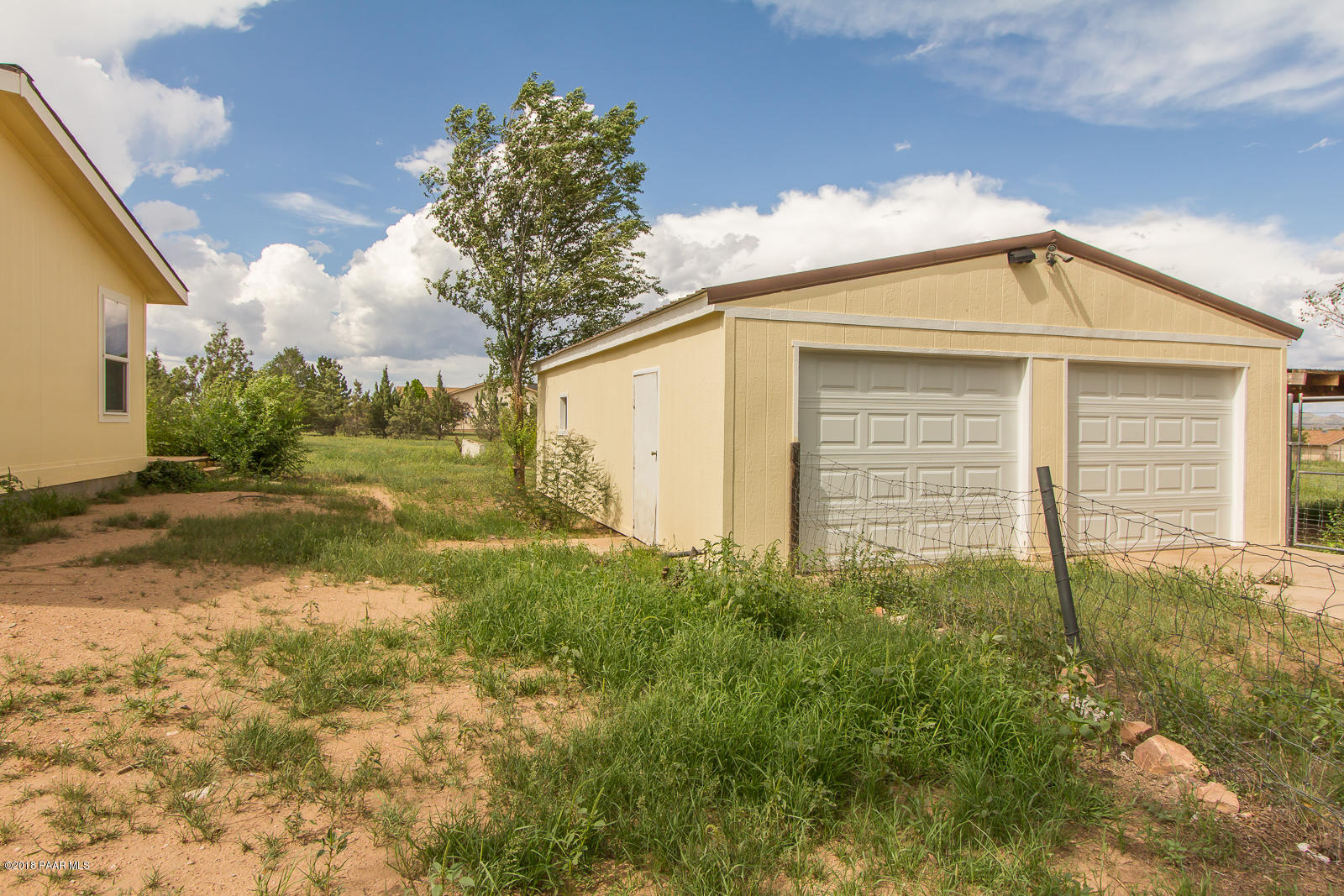 2691 North Reed Road Chino Valley, AZ 86323 - Photo 3 of 36 a view of backyard of house and green space