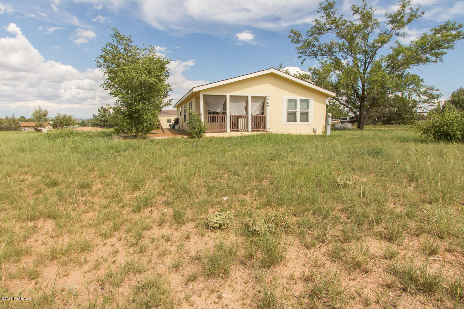 2691 North Reed Road Chino Valley, AZ 86323 - Photo 35 of 36 a view of a house with a yard