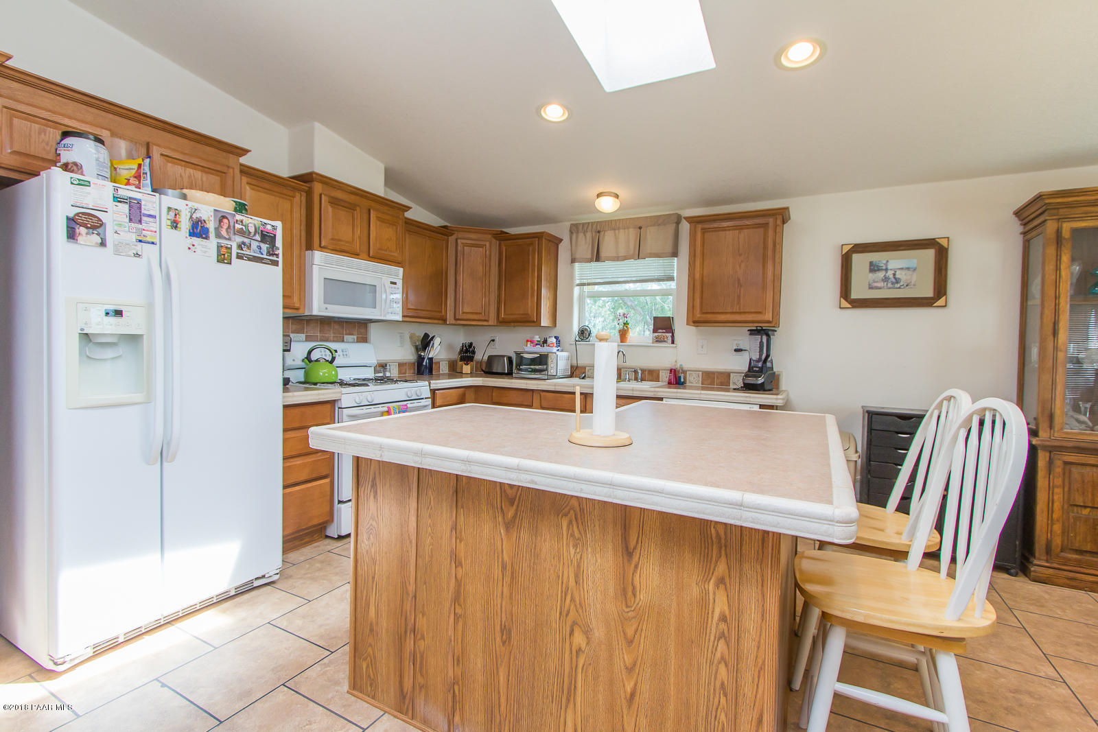 2691 North Reed Road Chino Valley, AZ 86323 - Photo 10 of 36 a kitchen with stainless steel appliances granite countertop a sink a refrigerator and a stove