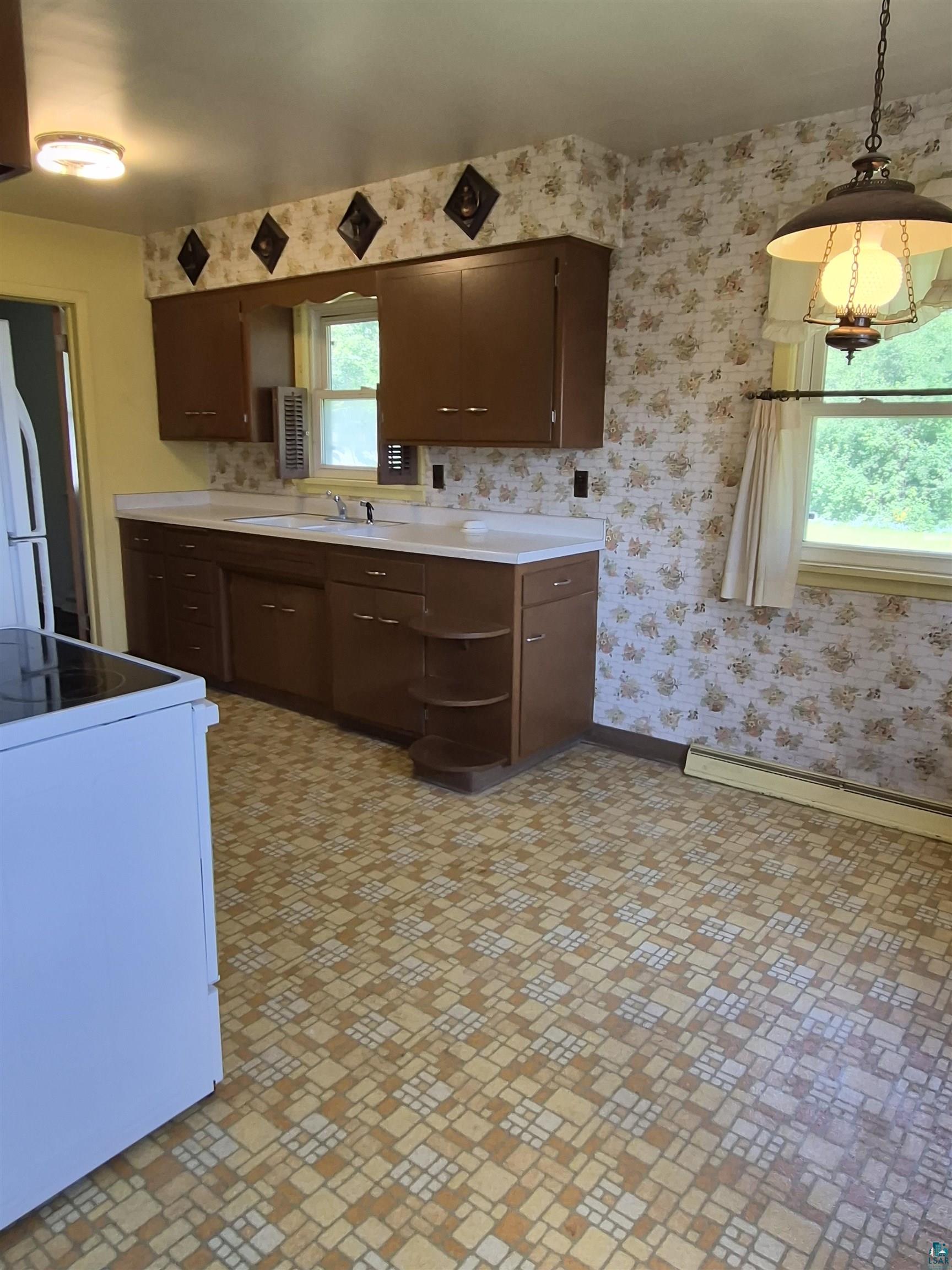 2109 West 22nd Street Duluth, MN 55811 - Photo 10 of 29 Kitchen space featuring wood cabinetry and white countertops
