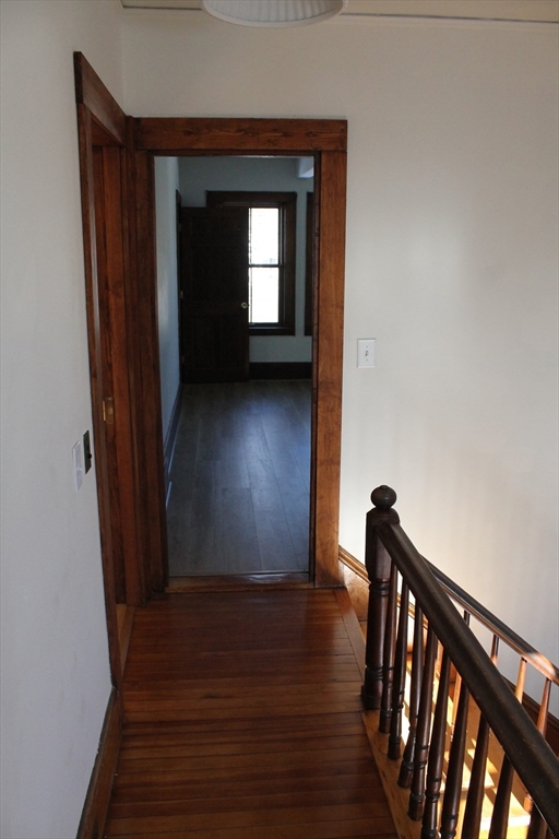 36 Maple Avenue, Unit 2 Bridgewater, MA 02324 - Photo 11 of 14 a view of a hallway view with wooden floor and staircase