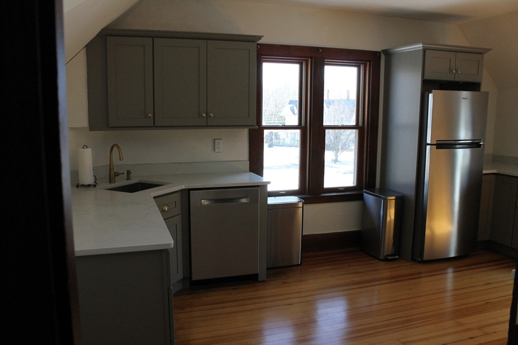 36 Maple Avenue, Unit 2 Bridgewater, MA 02324 - Photo 2 of 14 a kitchen with a refrigerator and window