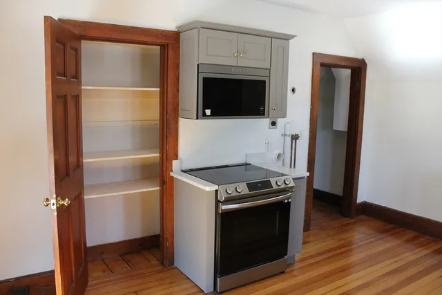 a kitchen with a stove and a refrigerator