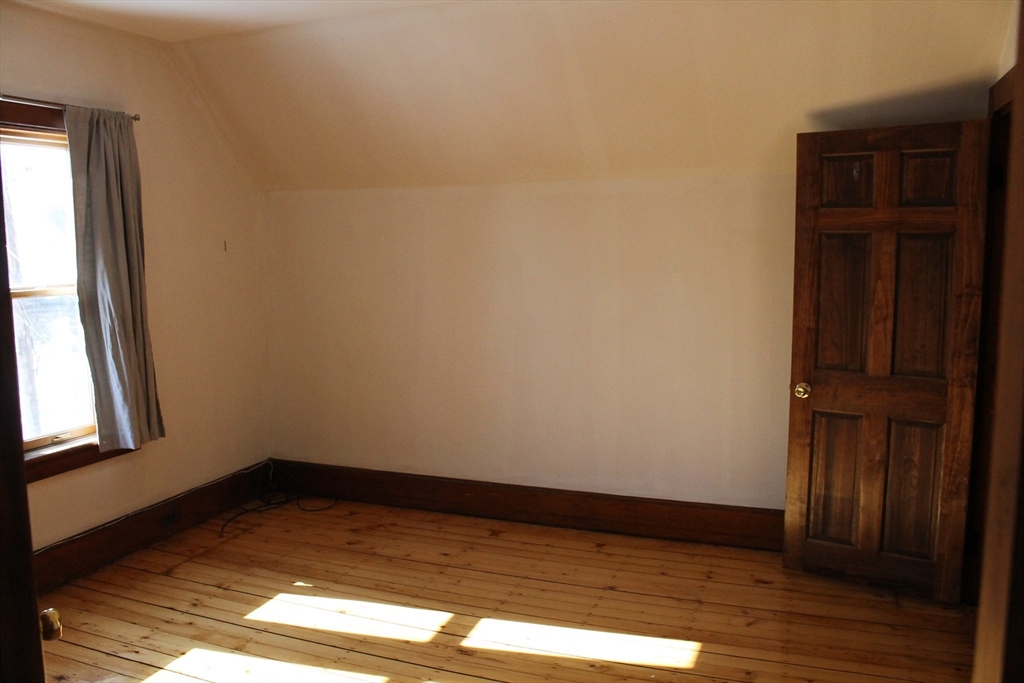 36 Maple Avenue, Unit 2 Bridgewater, MA 02324 - Photo 8 of 14 a view of empty room with wooden floor and fan