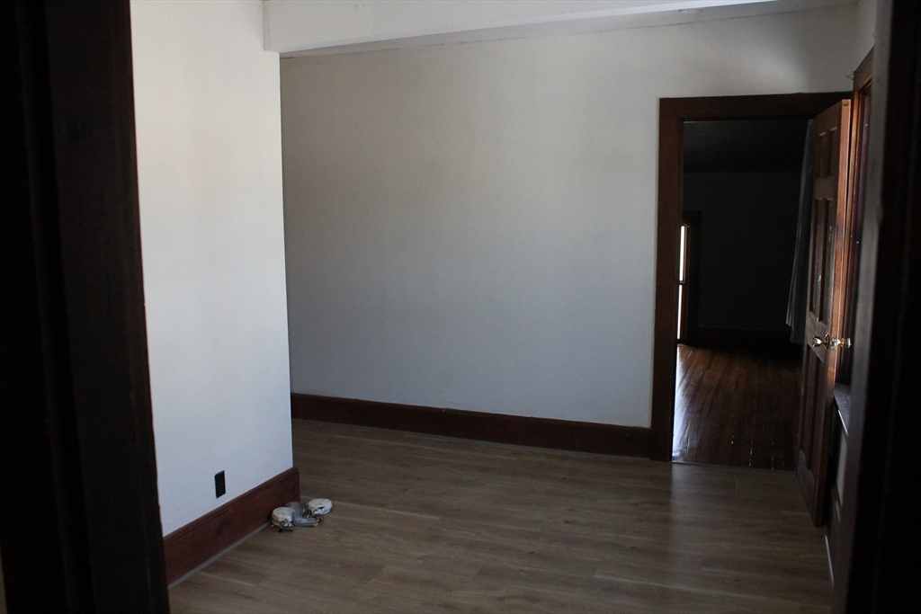 36 Maple Avenue, Unit 2 Bridgewater, MA 02324 - Photo 9 of 14 an empty room with wooden floor and closet