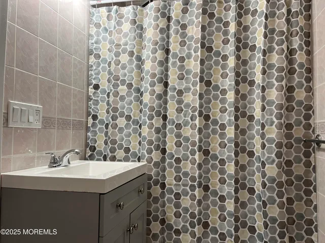 a bathroom with a sink and mirror