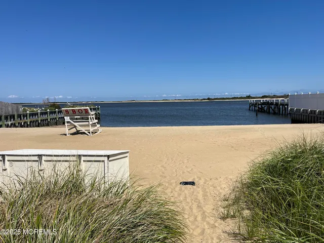 a view of a lake with houses in the back
