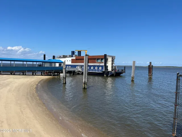 a view of a swimming pool with a table and chairs