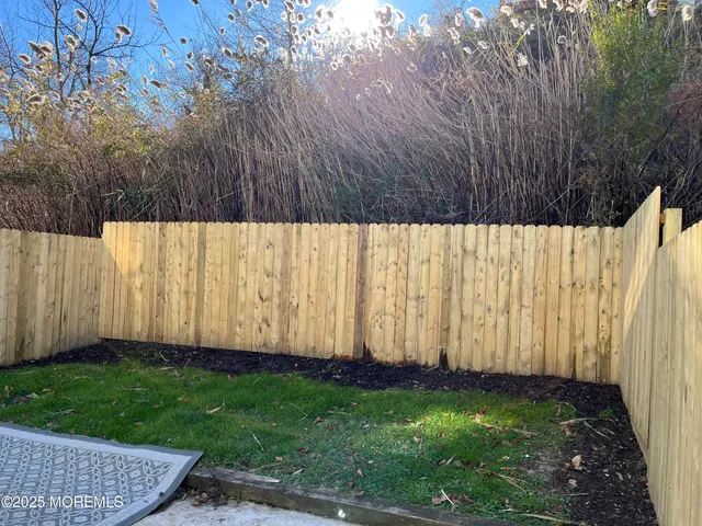 a view of backyard with green space