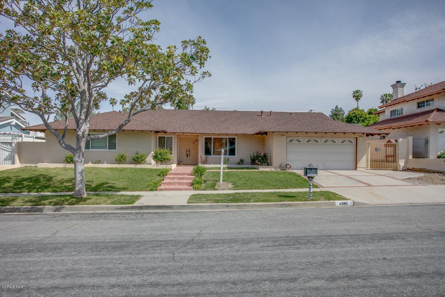 4295 Springfield Street Simi Valley, CA 93063 - Photo 1 of 40 a front view of a house with a yard
