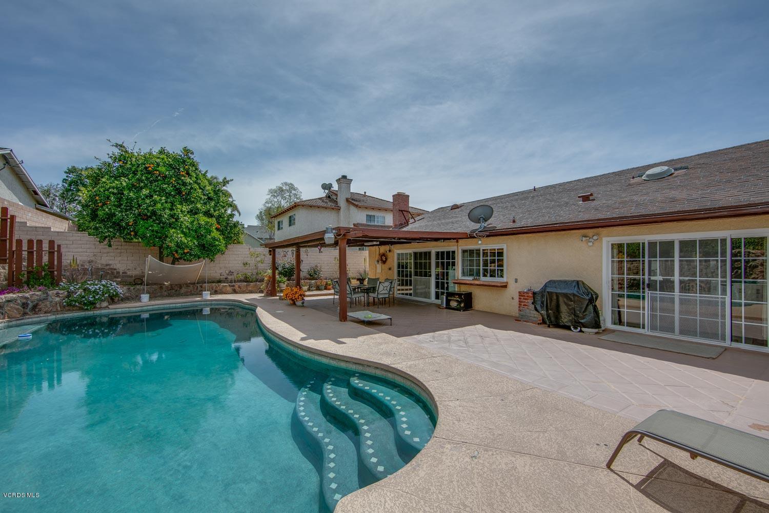 4295 Springfield Street Simi Valley, CA 93063 - Photo 2 of 40 a view of a house with backyard patio and swimming pool